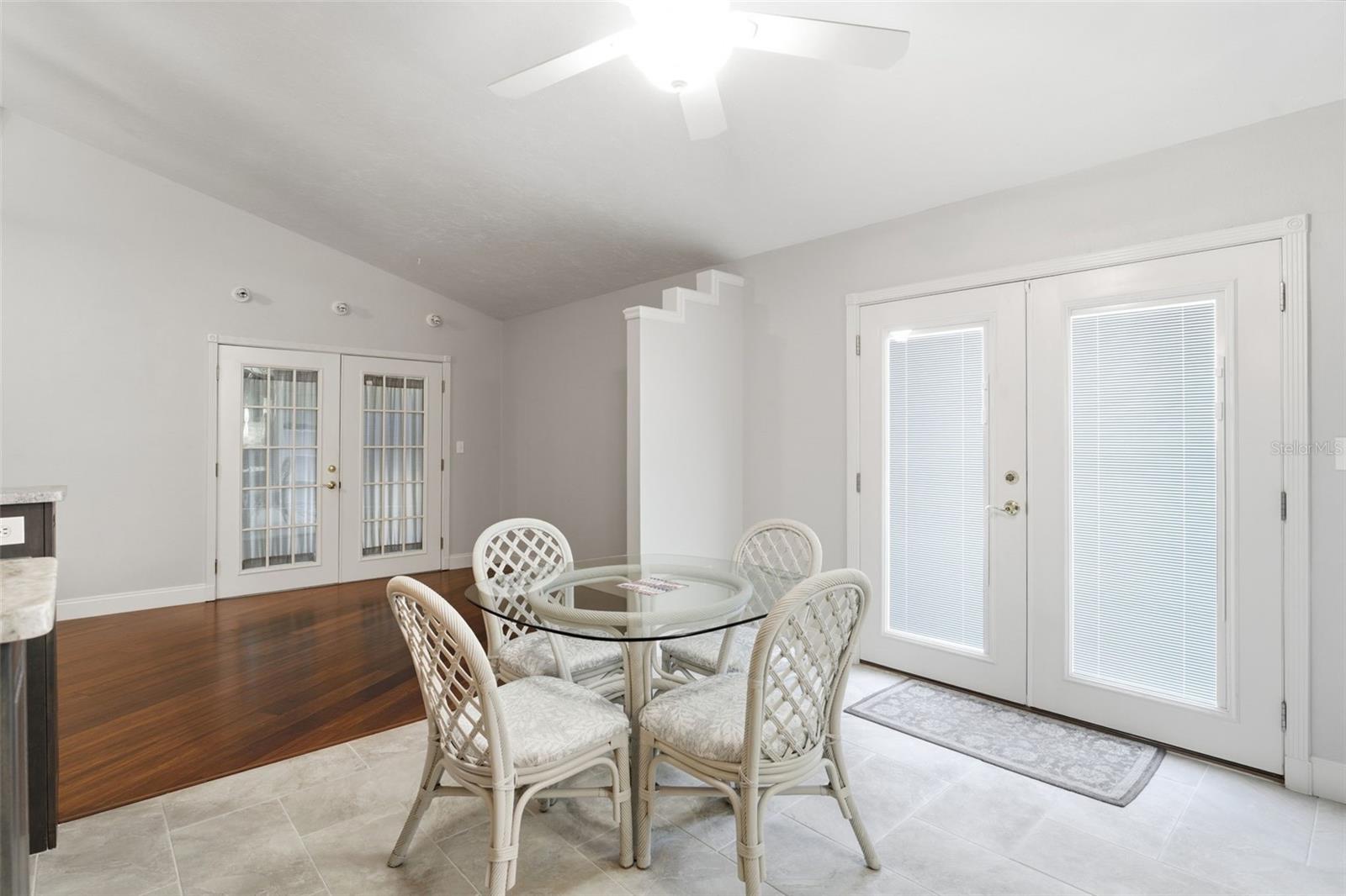 Casual Dining Area Between Kitchen & Formal Dining Room with Doors To Open Deck