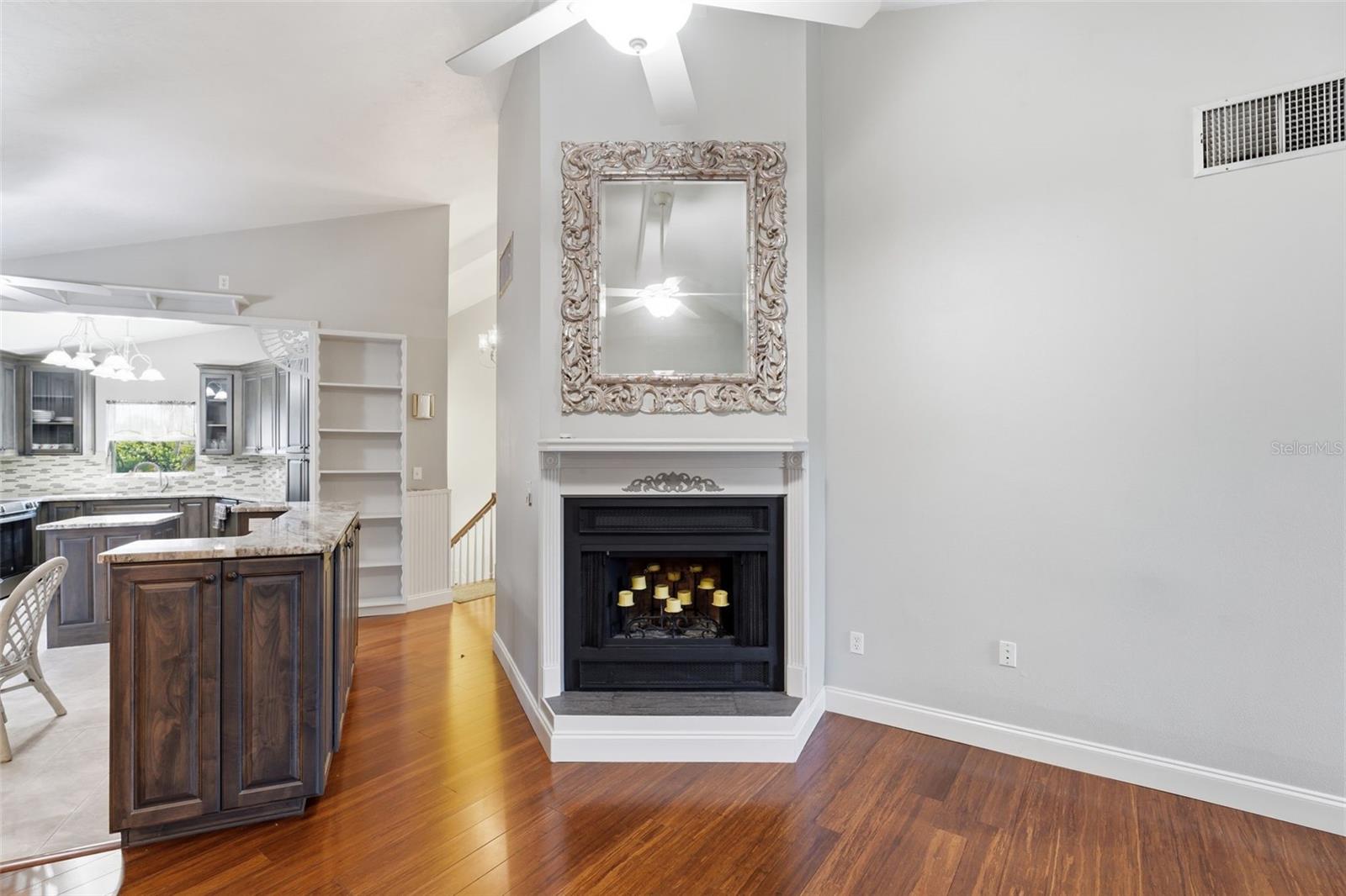 WOOD-BURNING FIREPLACE FACING LIVING & DINING ROOMS