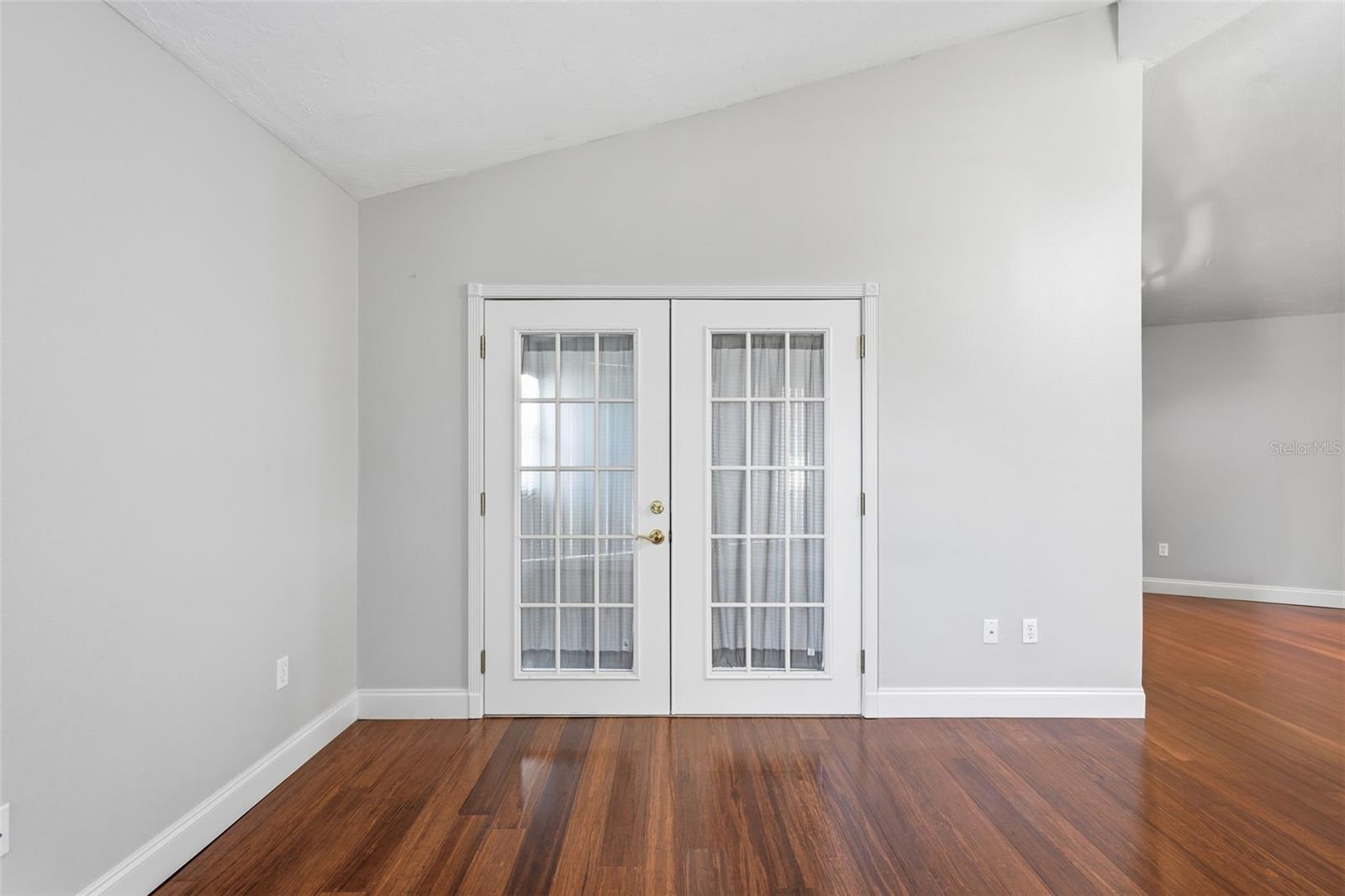 FRENCH DOORS FROM LIVING ROOM TO SUNPORCH