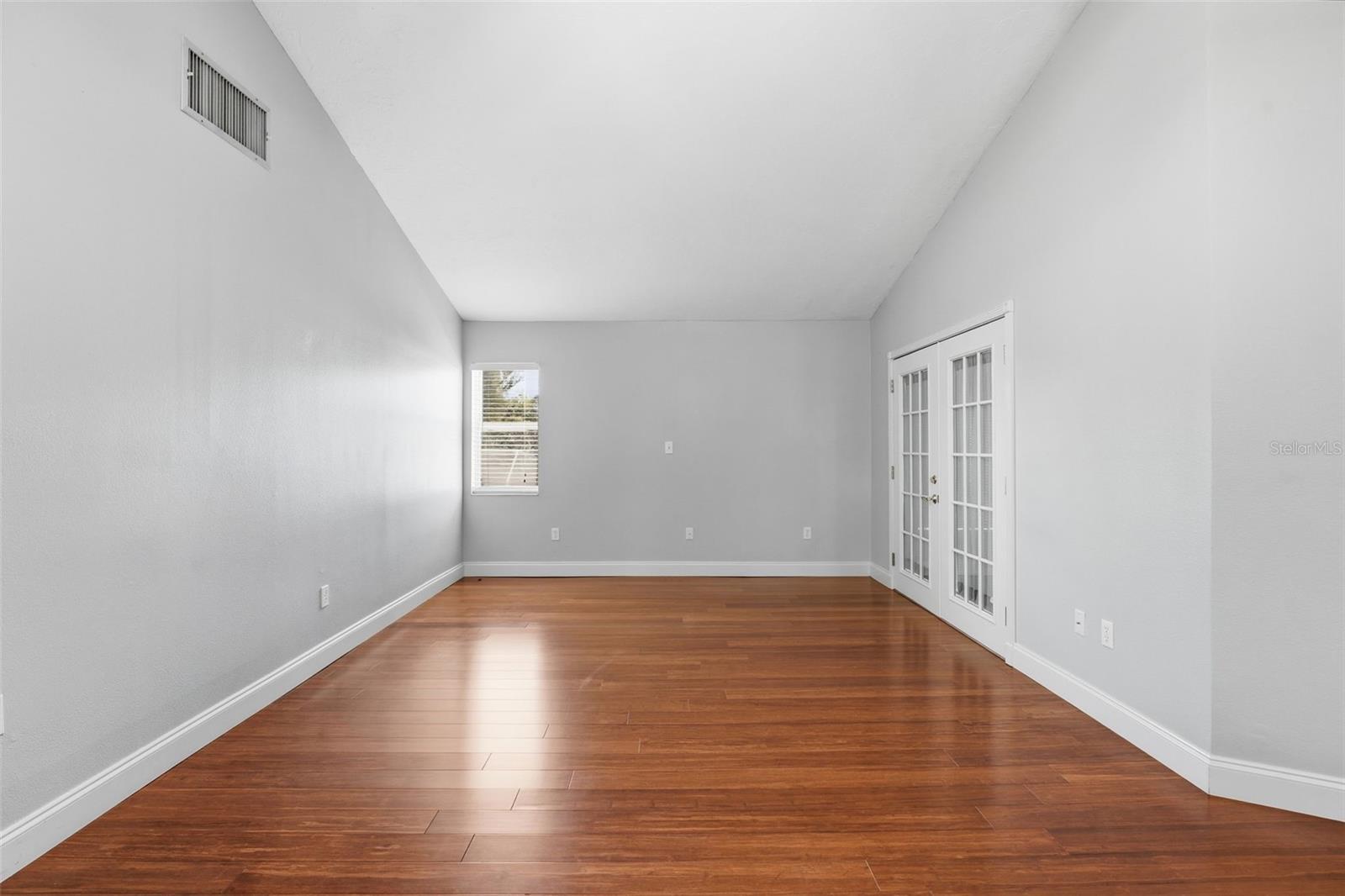LIVING ROOM WITH FRENCH DOORS TO SUNPORCH