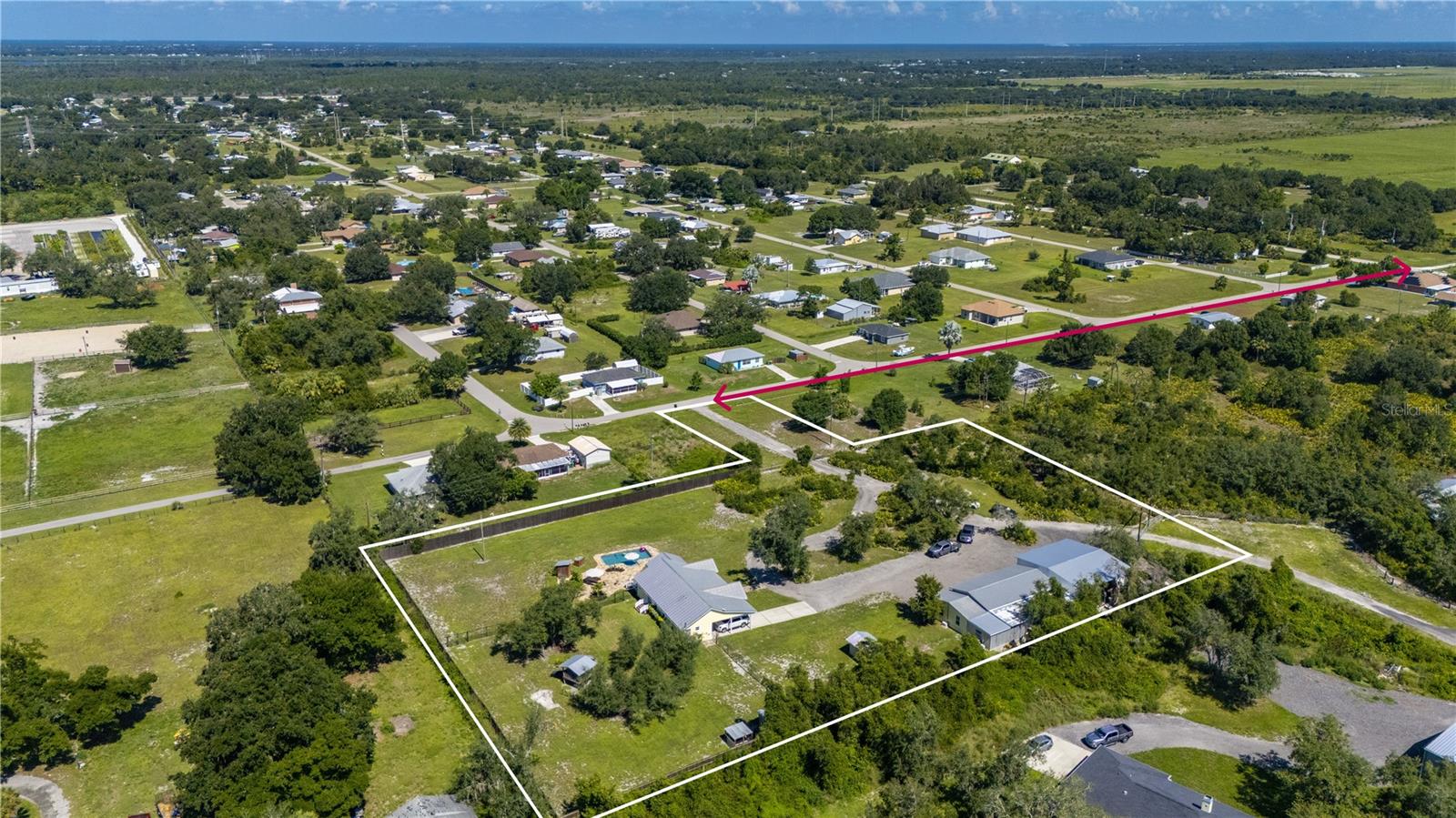 RED ARROW SHOWS ACCESS FROM WASHINGTON LOOP ON MANGROVE ROAD TO ENTRANCE