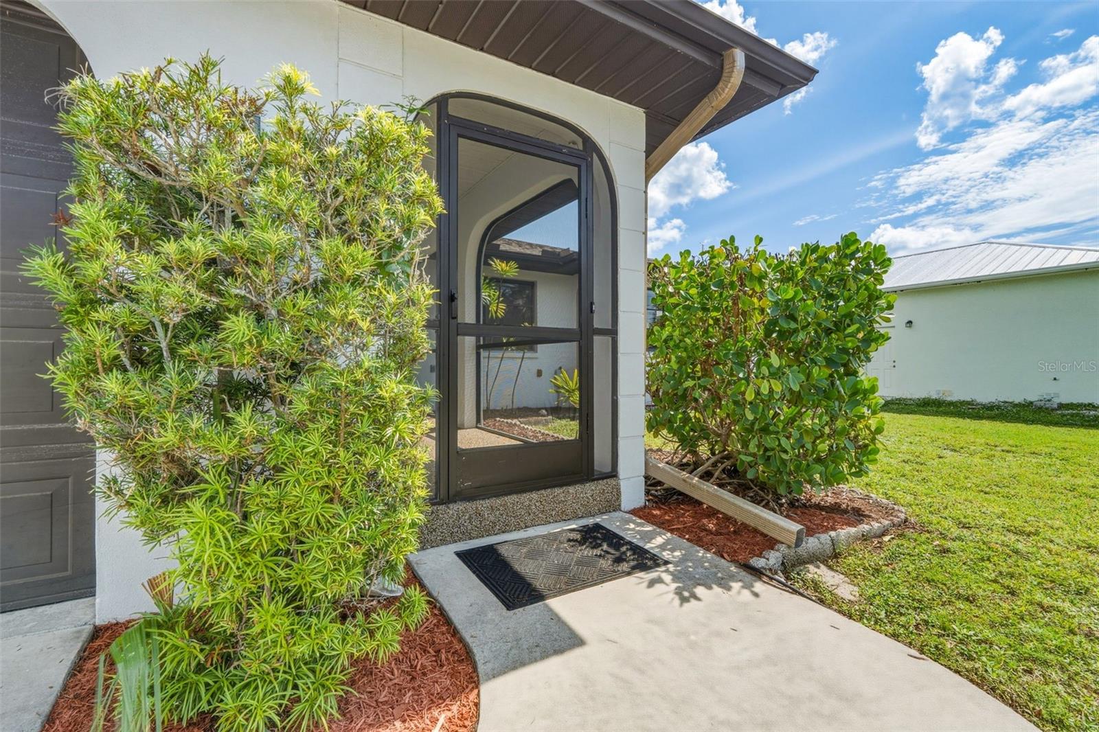 Welcoming Screened Front Entry