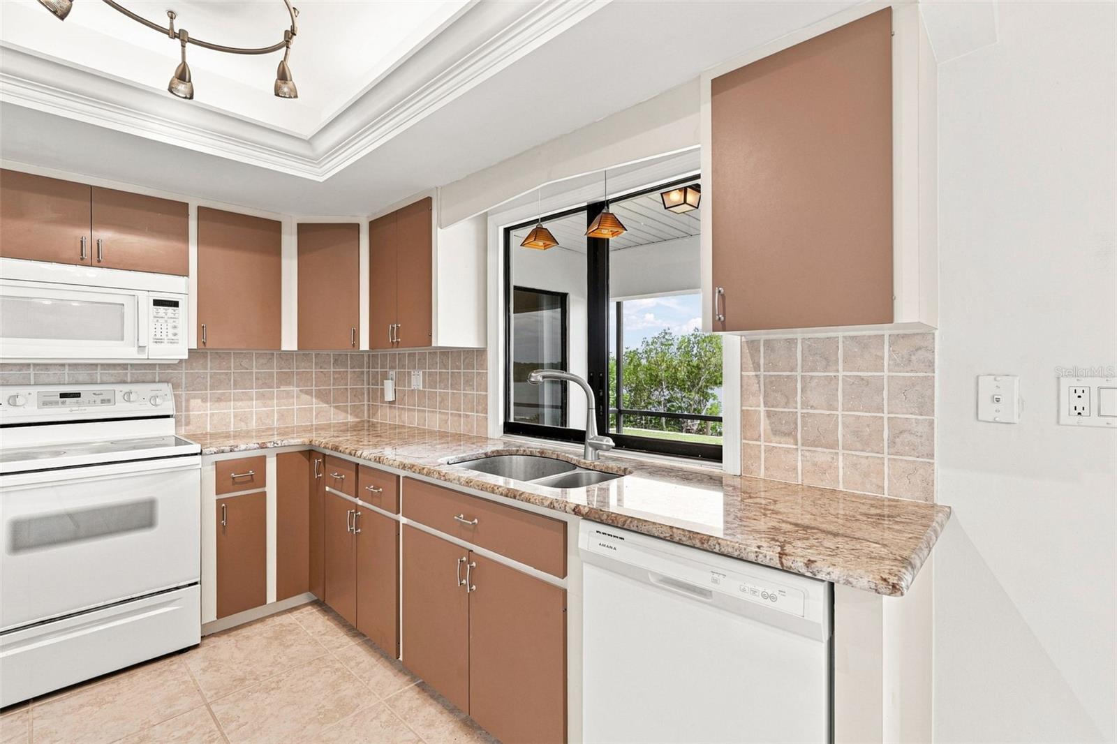 Kitchen Featuring, Granite Countertops,  Tray Ceiling and Waterfront views