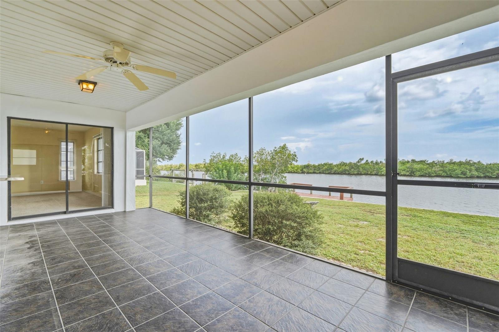 Screened Patio off Primary Bedroom with Peaceful Water Views