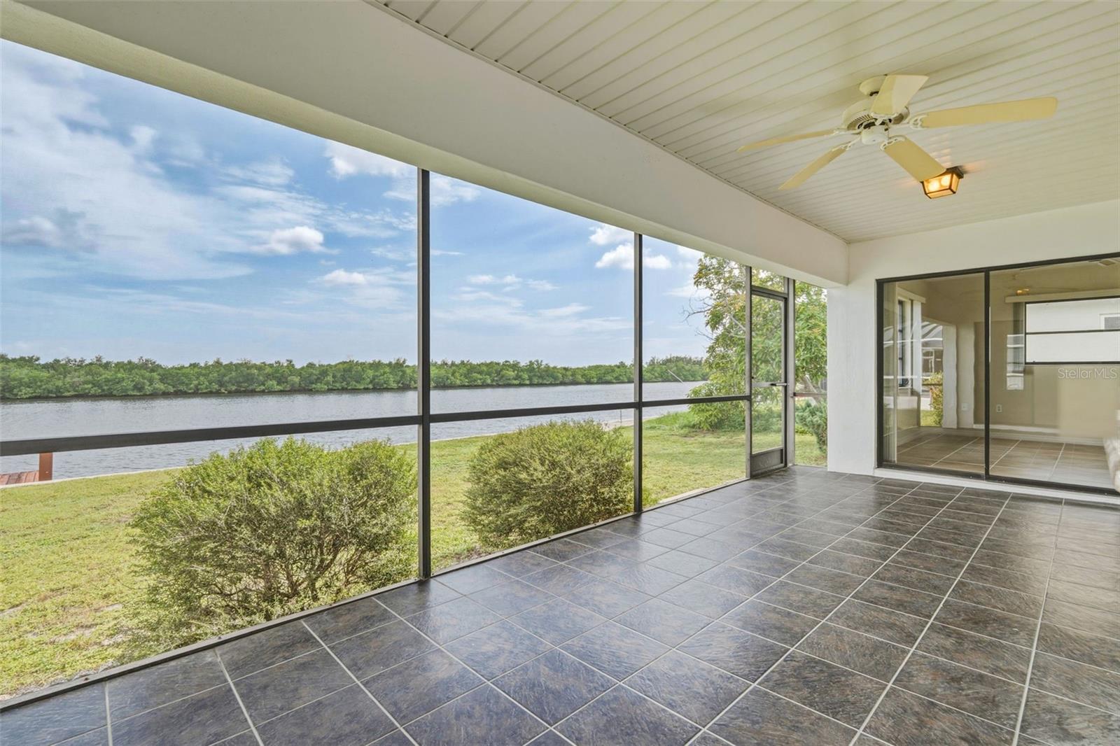 Screened Patio with Access to Dining Area and Primary Bedroom