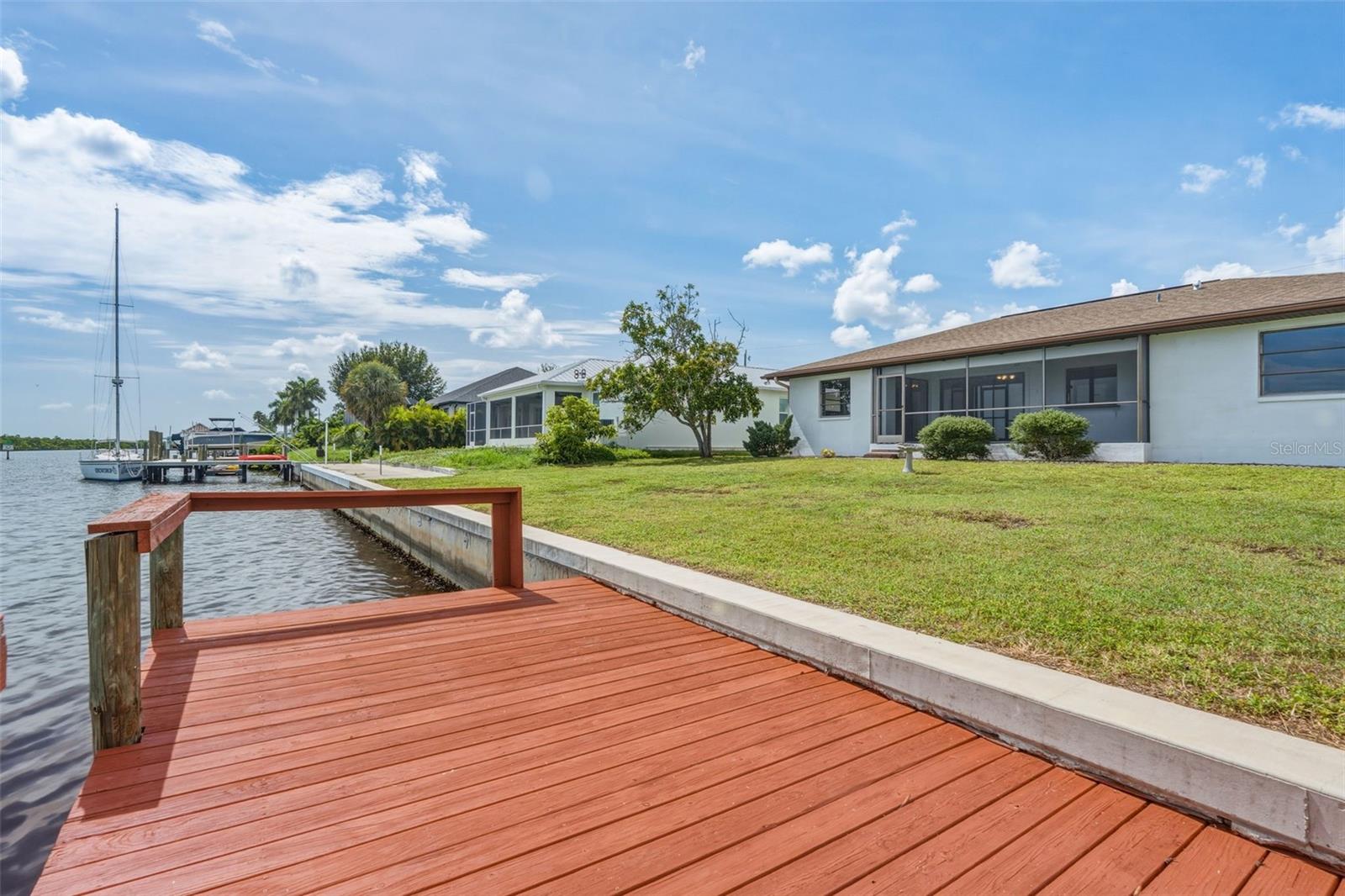 Enjoy Waterfront Living with Your Private Dock and Spacious Backyard