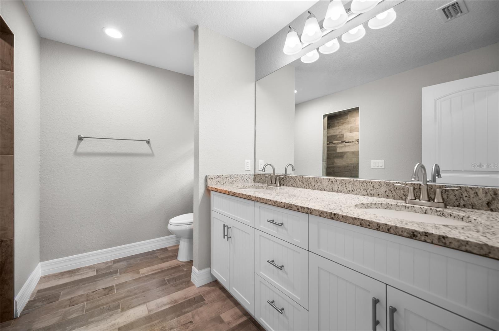 Matching Granite counter tops throughout the home.