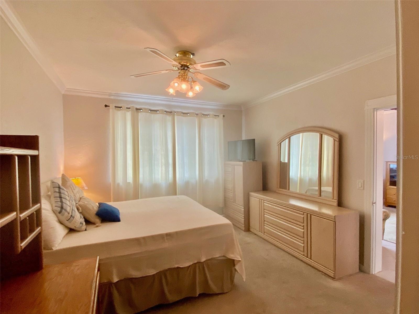 Master bedroom and furniture TV door to great room