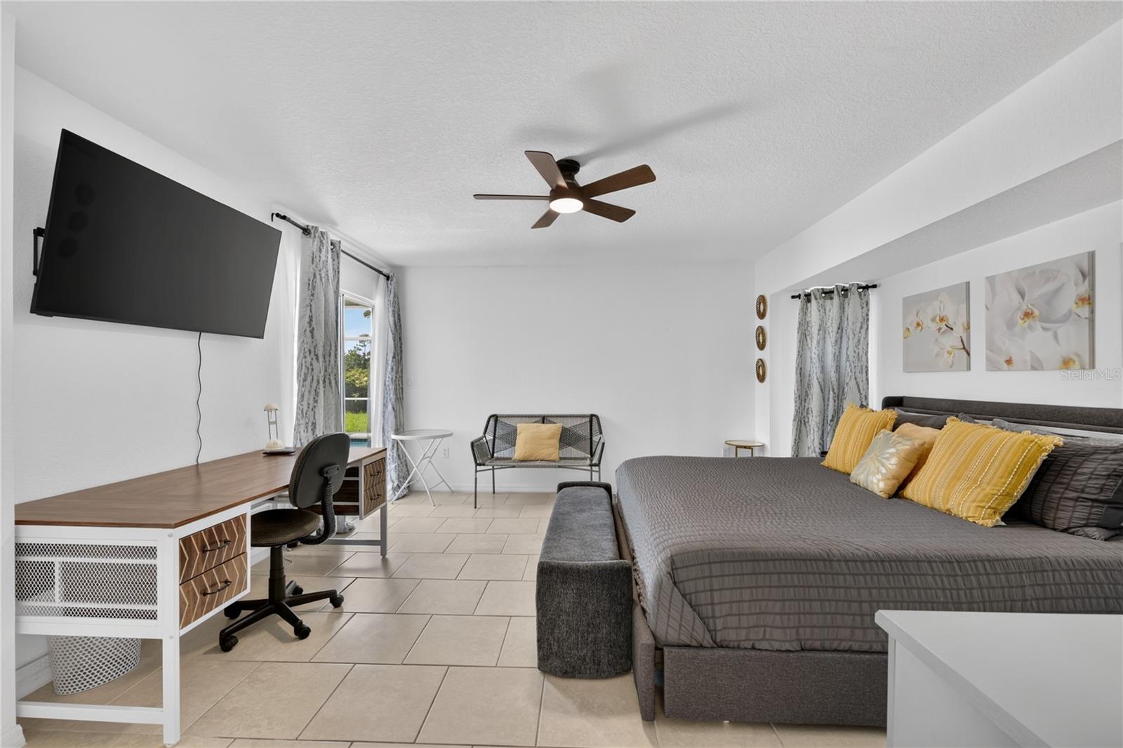 Primary Bedroom with sliding doors to the pool area.