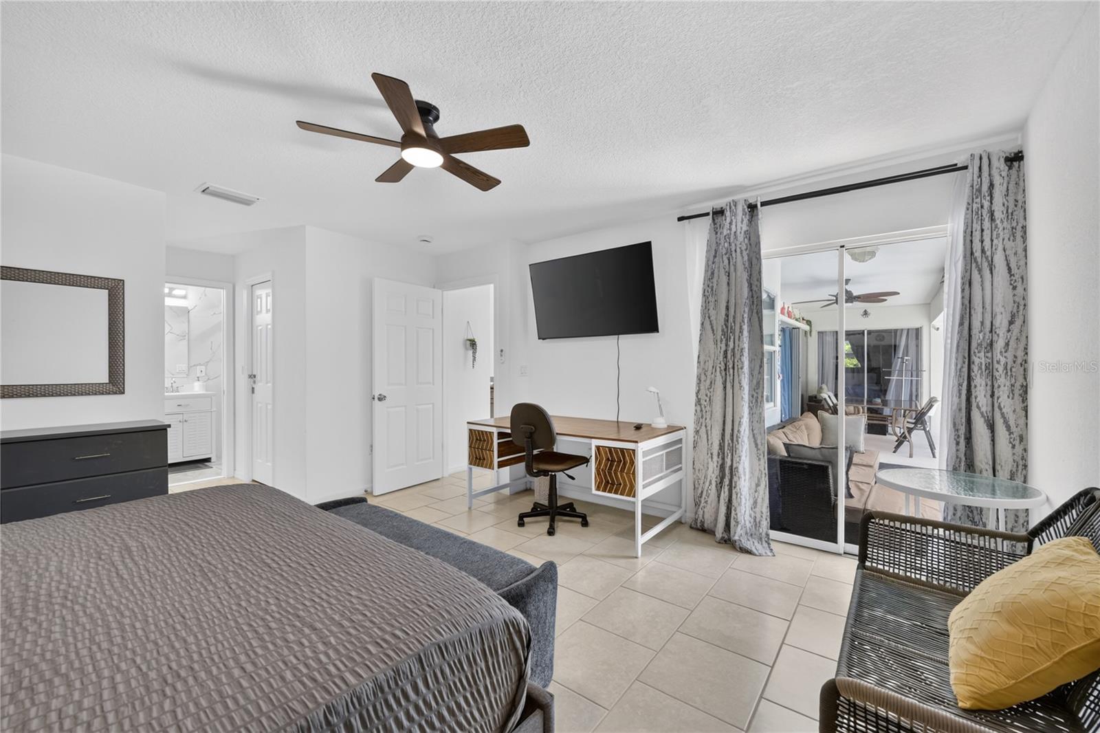 Primary Bedroom with sliding doors to the pool area.