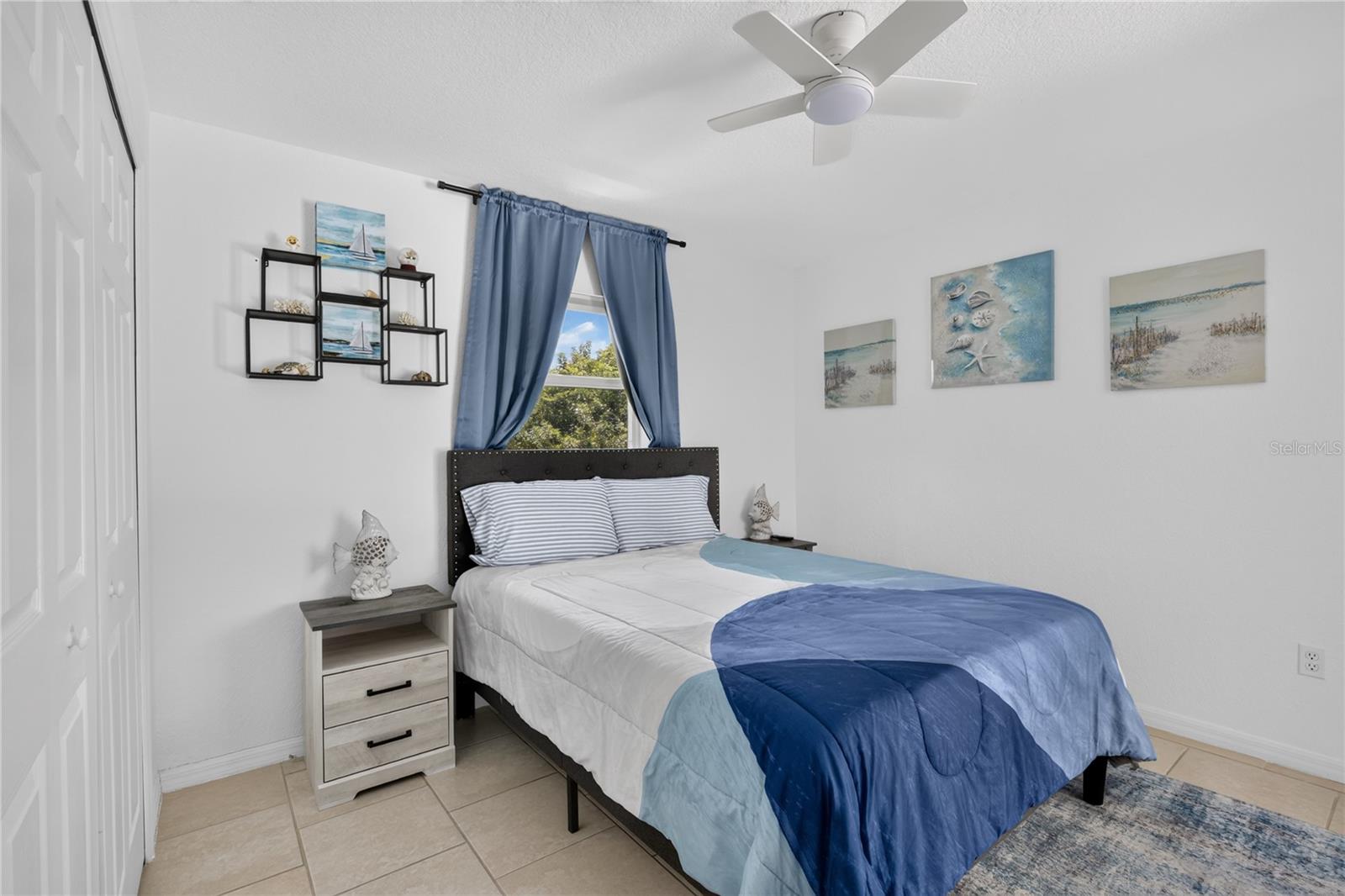 Bedroom #3 with sliding doors to the pool area.
