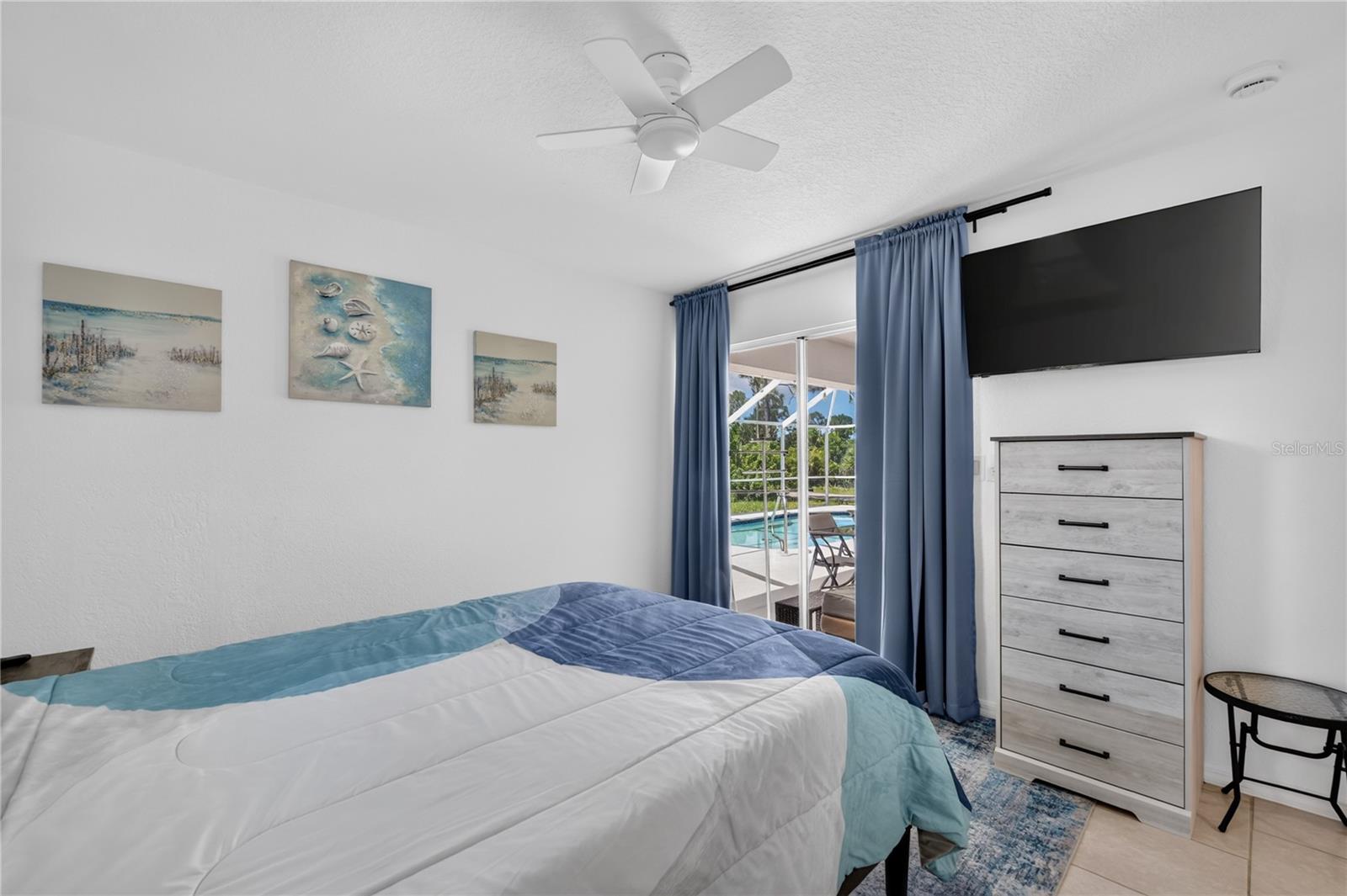 Bedroom #3 with sliding doors to the pool area.