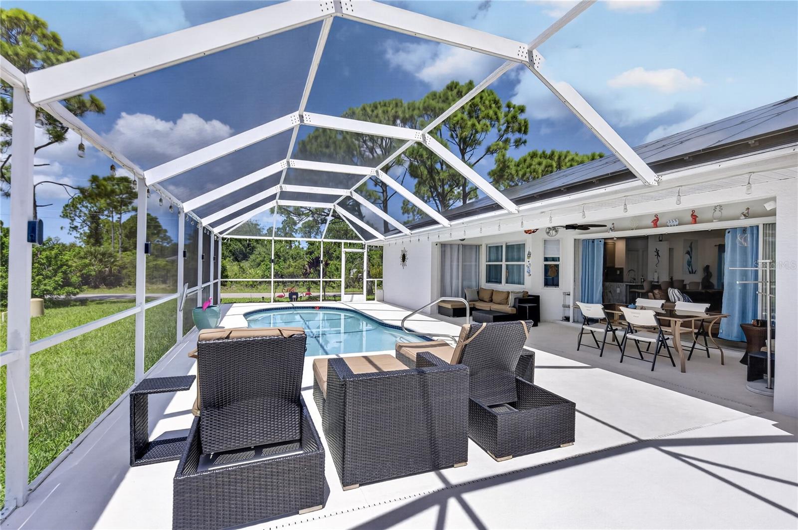 Pool lounge and outdoor dining areas.