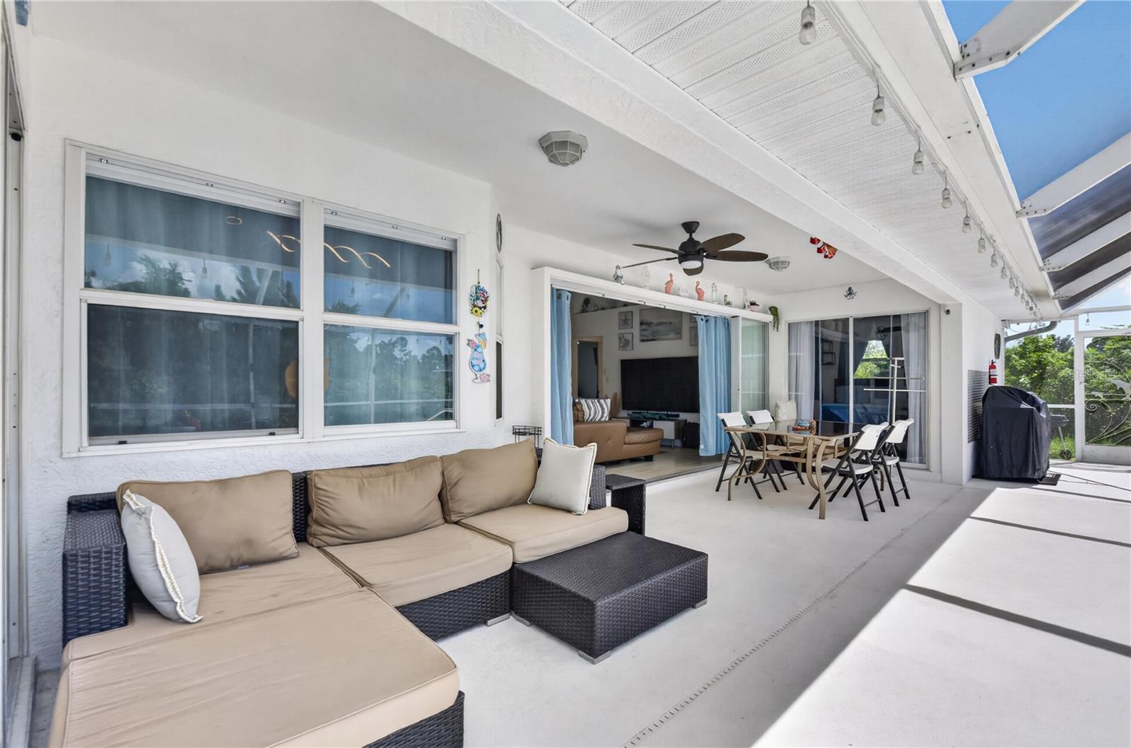 Covered lounge areas by the pool.