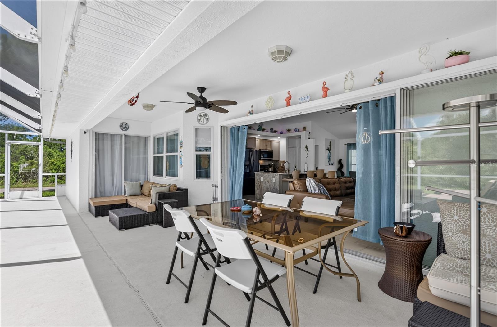 Covered outdoor dining area by the pool.