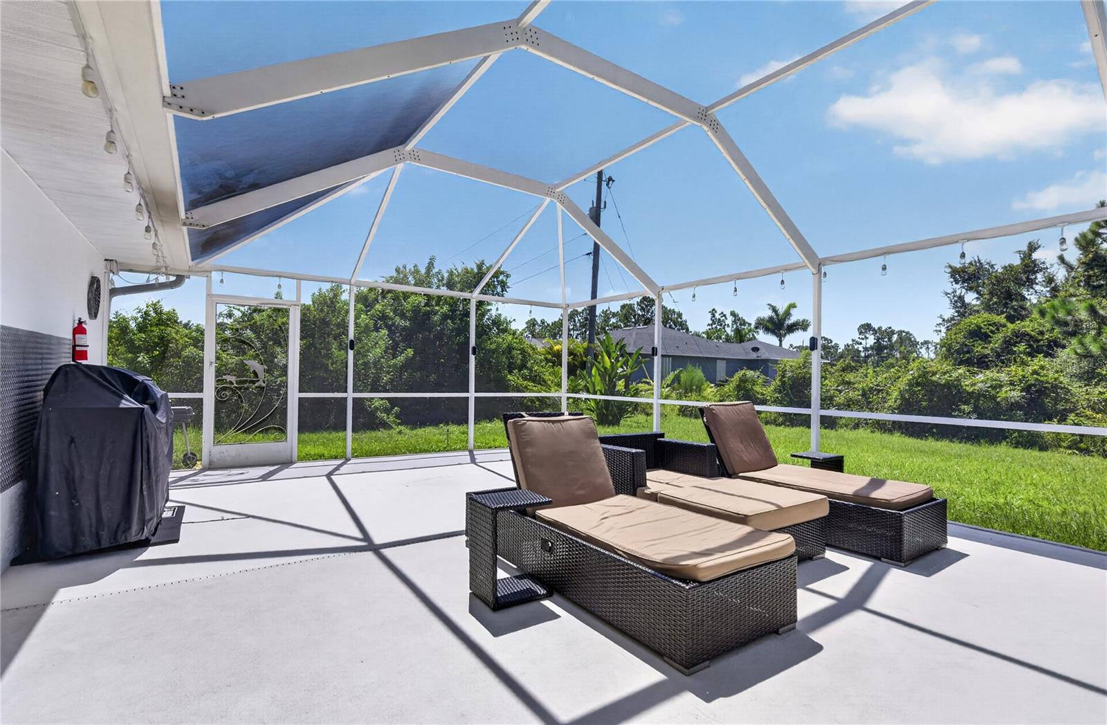 Barbeque and lounge area by the pool.
