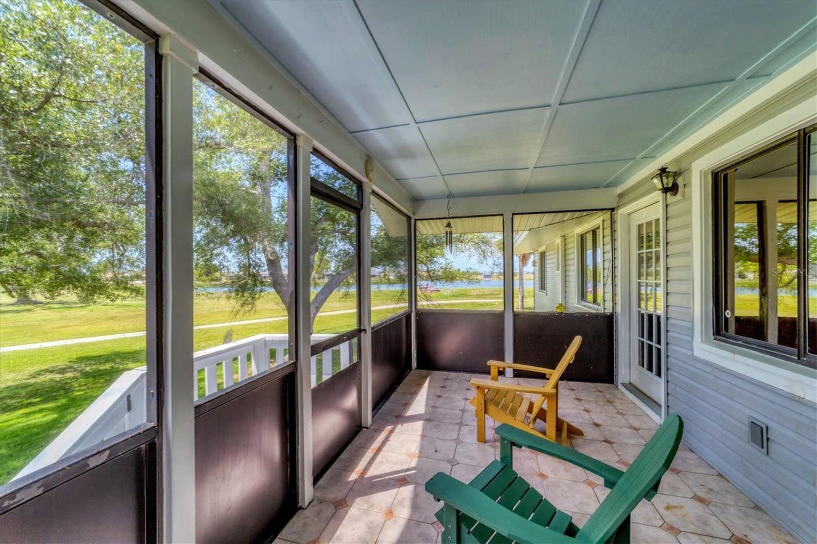 Screened lanai with pond and golf course view
