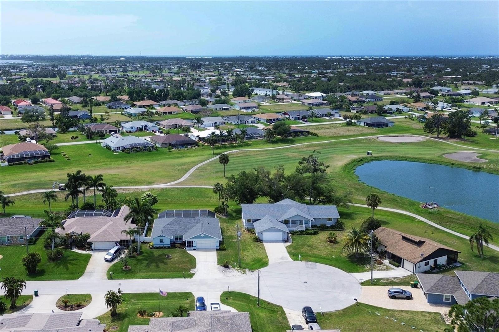 Home, Pond, & Golf Course from above