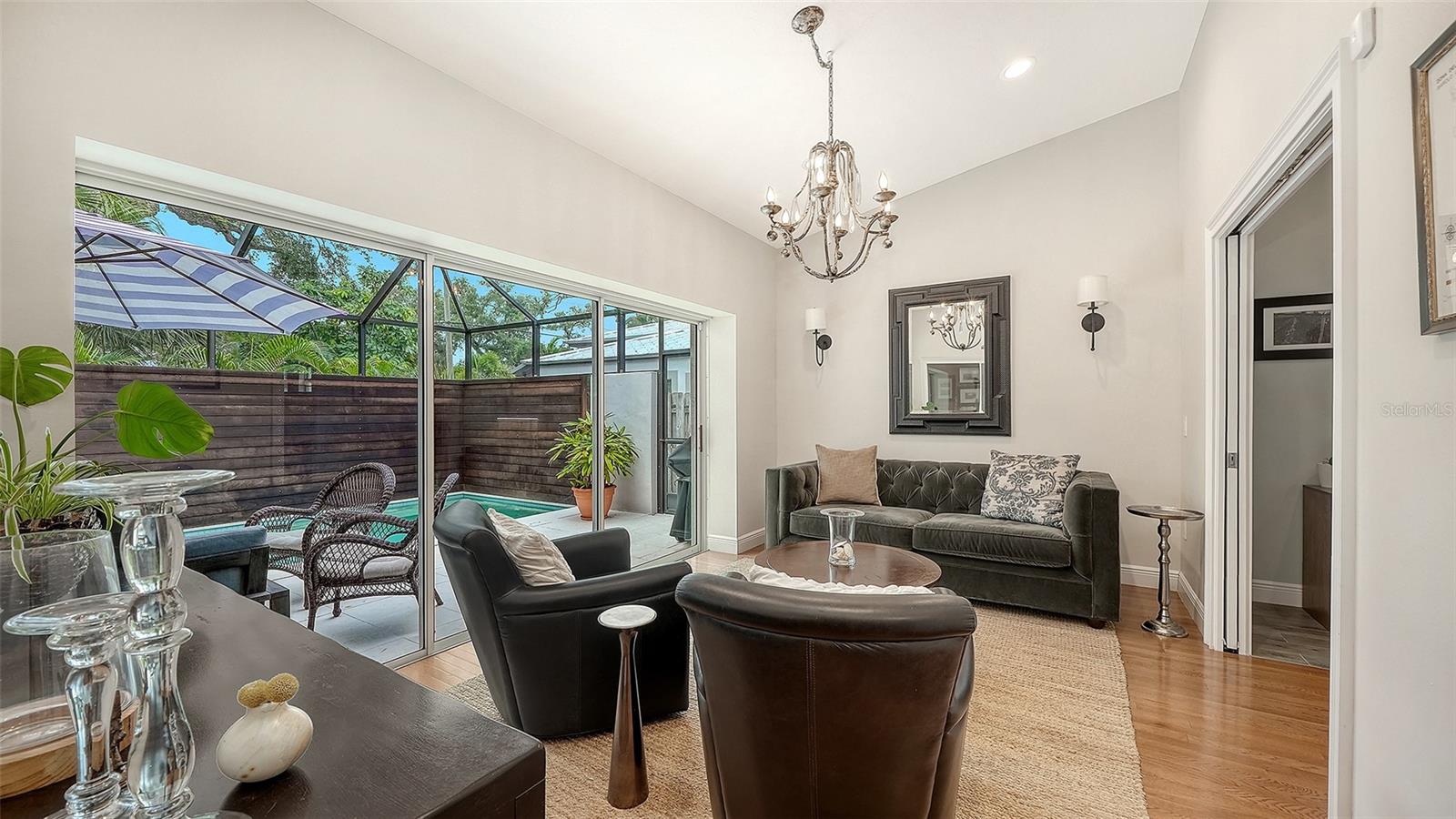 Stylish flex space offers versatility for additional entertaining, dining, or living while maintaining the home’s refined aesthetic.