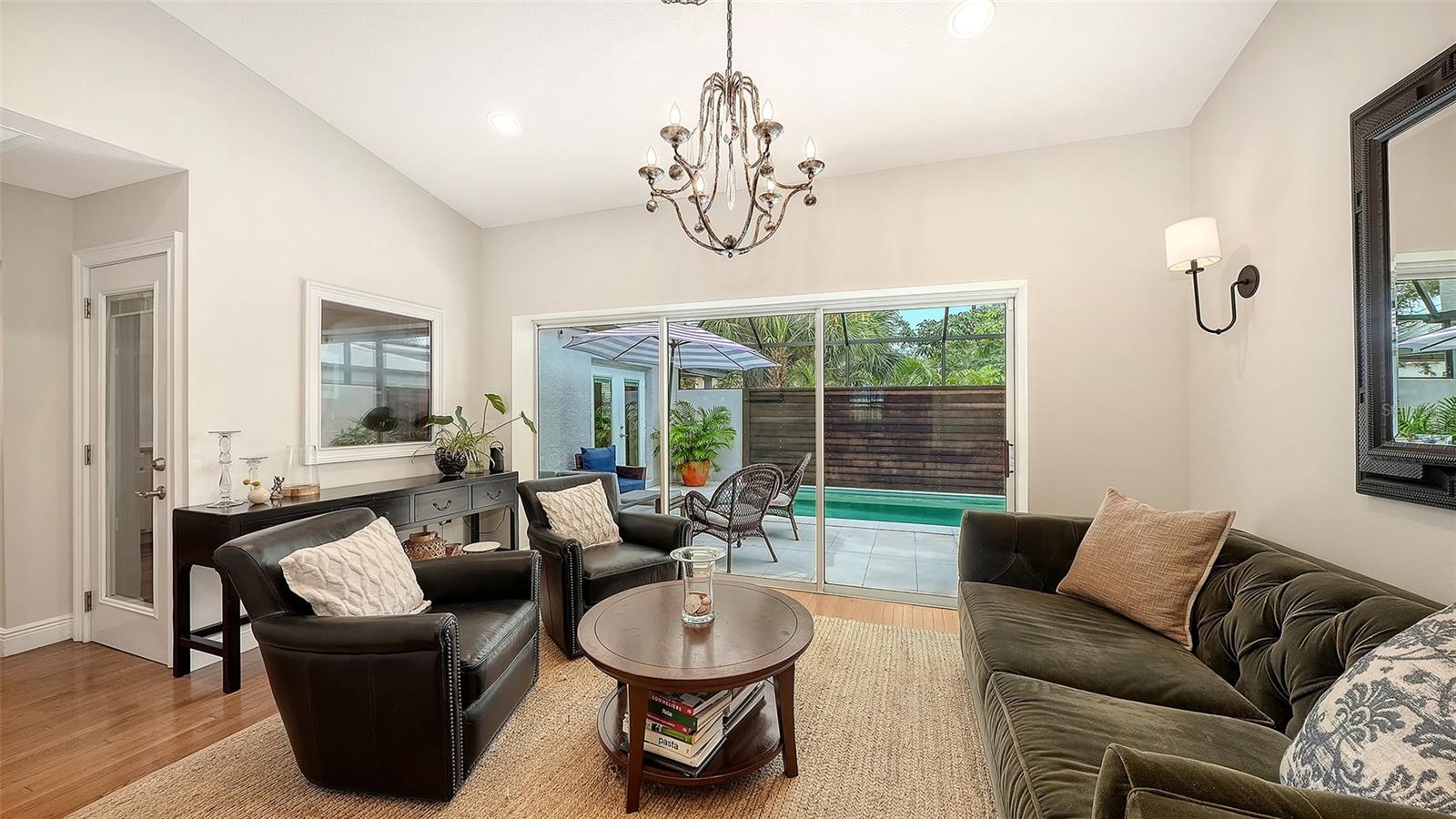 Elegant bonus area provides flexible living space with generous proportions, natural light, and seamless access to the private outdoor retreat.