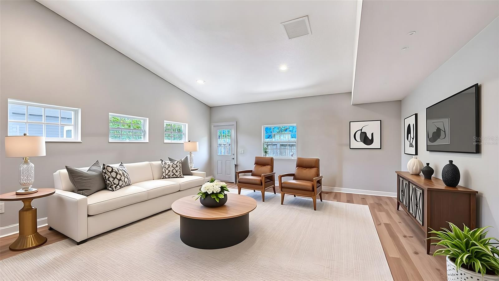 Virtually staged alternative living-room configuration demonstrates the impressive versatility of the downstairs bonus area.
