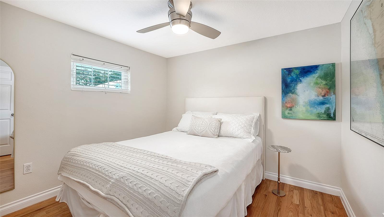 Comfortable bedroom 3 offers hardwood floors, generous natural light, and a tranquil, polished atmosphere.