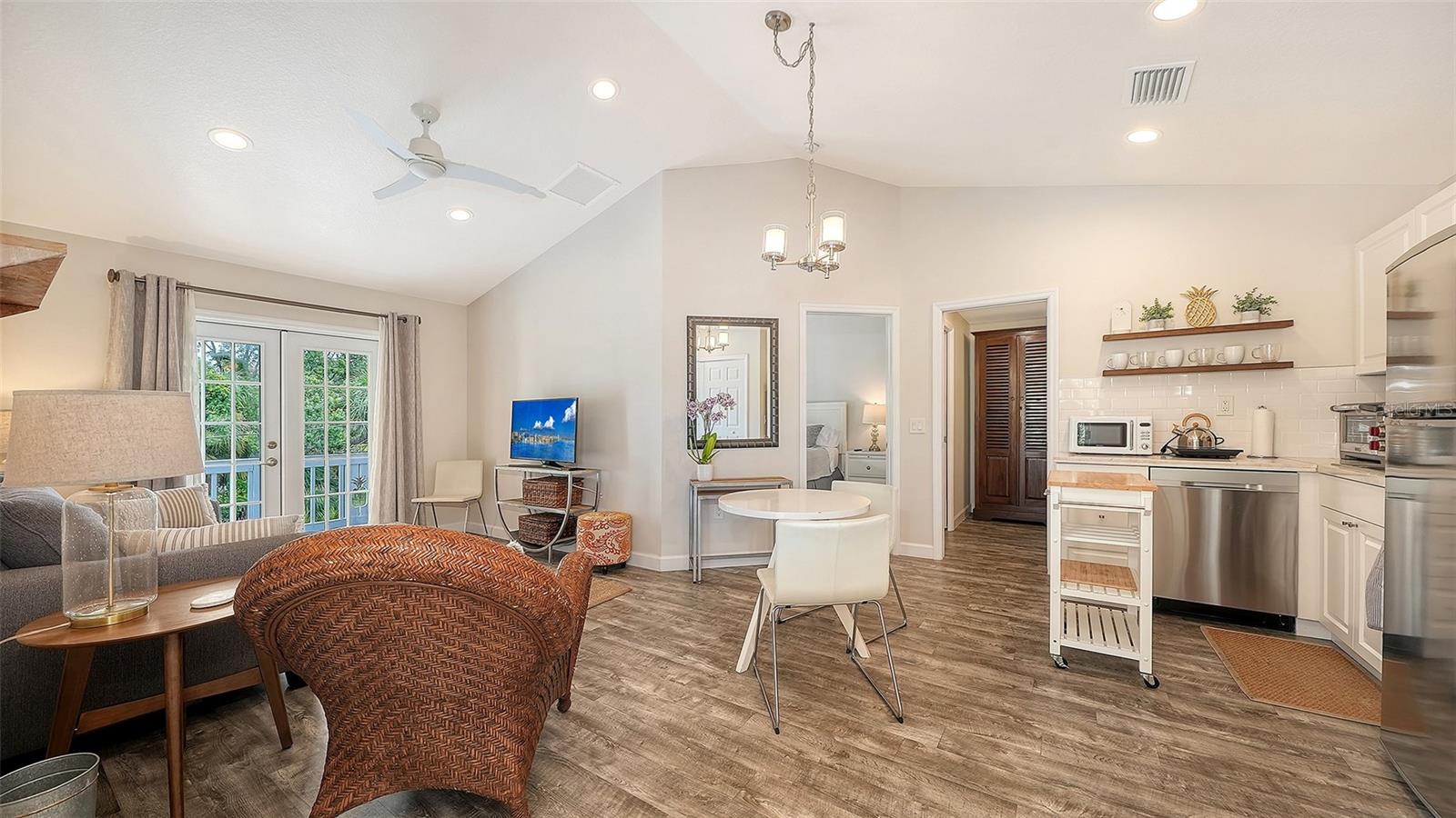The Pineapple Loft offers a beautifully appointed open-concept living and dining area within the private guest apartment.