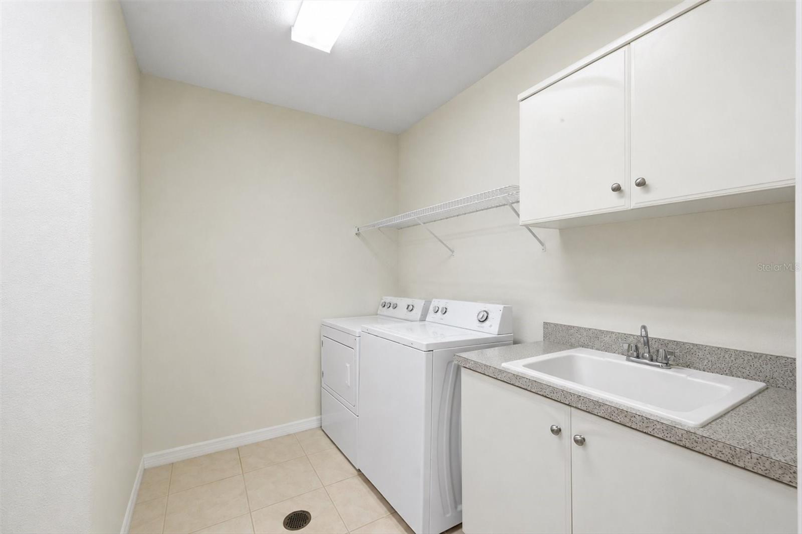 Laundry Room with Sink and Cabinets
