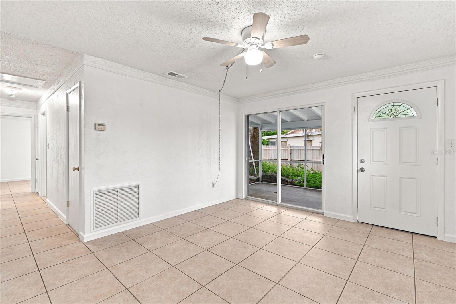 Tiled Floor in Living Area with Sliding Glass Door