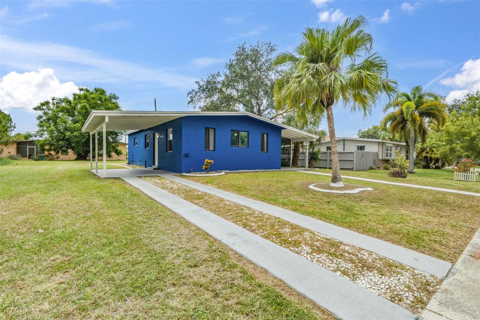 Welcoming Exterior with Tropical Curb Appeal
