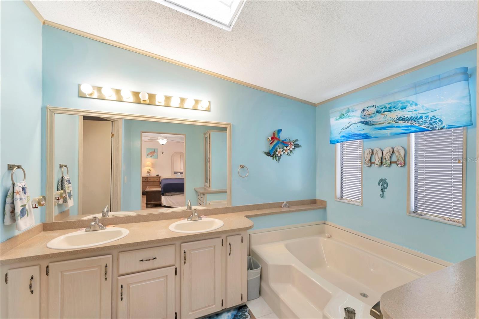 Step into your own soaking tub in the primary en-suite bathroom