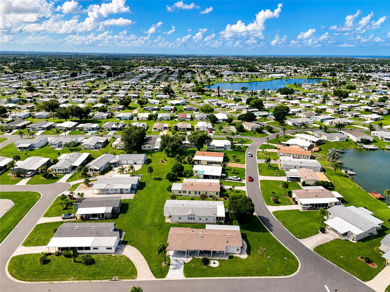 Aerial view of home on corner lot in beautiful Lemon Bay Isles