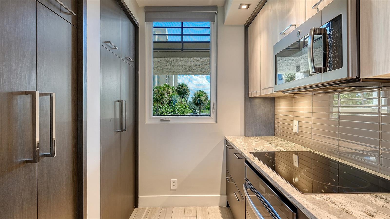 washer/dryer behind doors to left