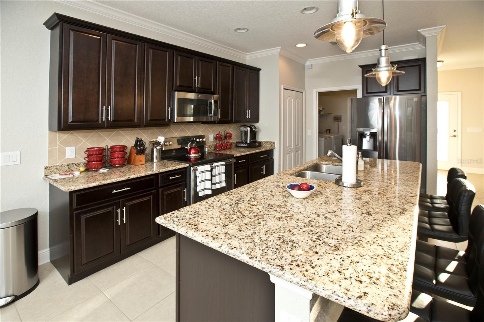 Kitchen towards laundry and garage.