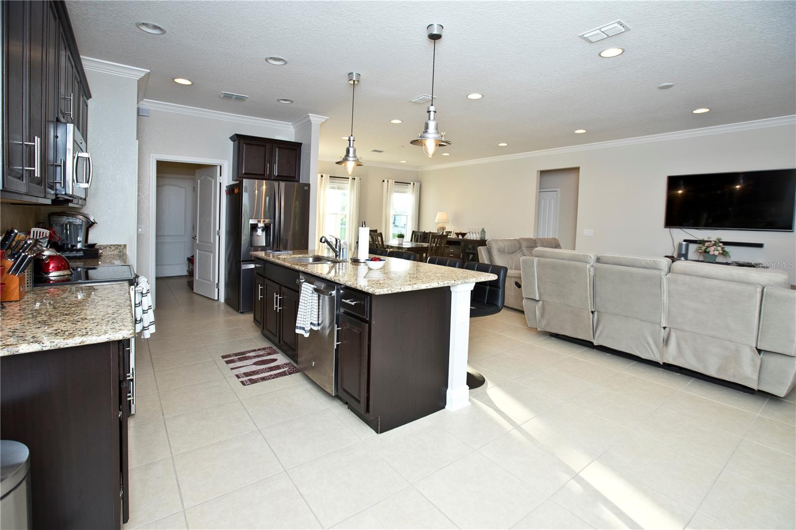 Kitchen, great room, and dining room.