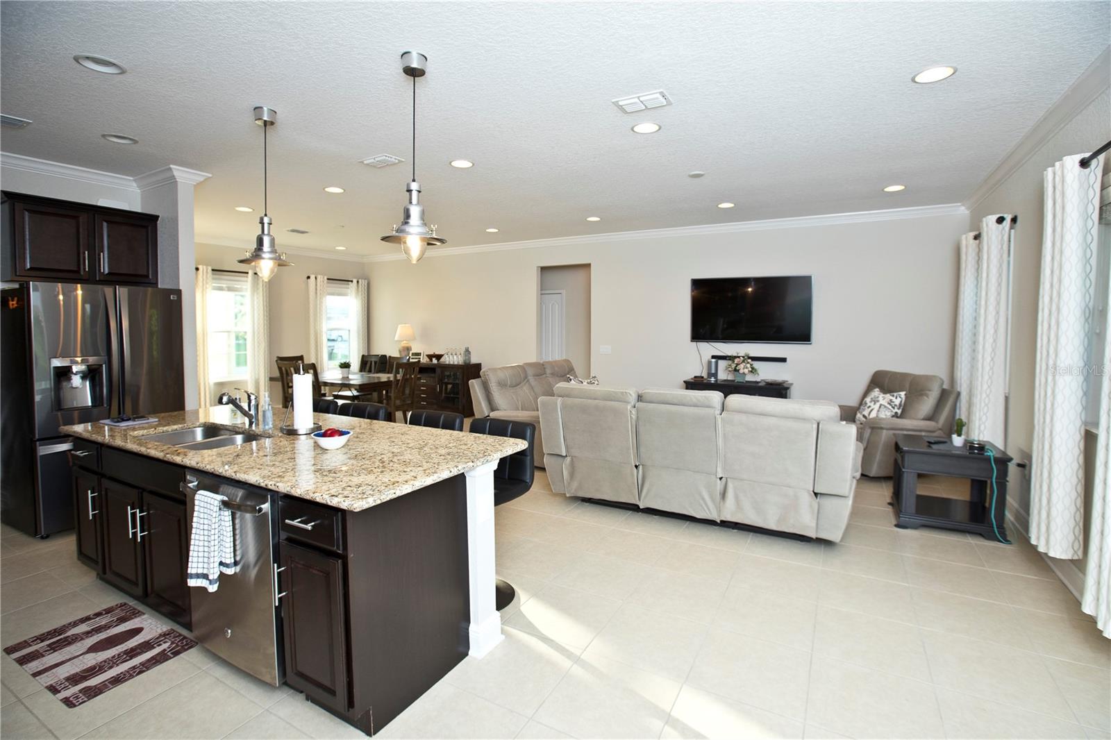 Kitchen, great room, and dining room.