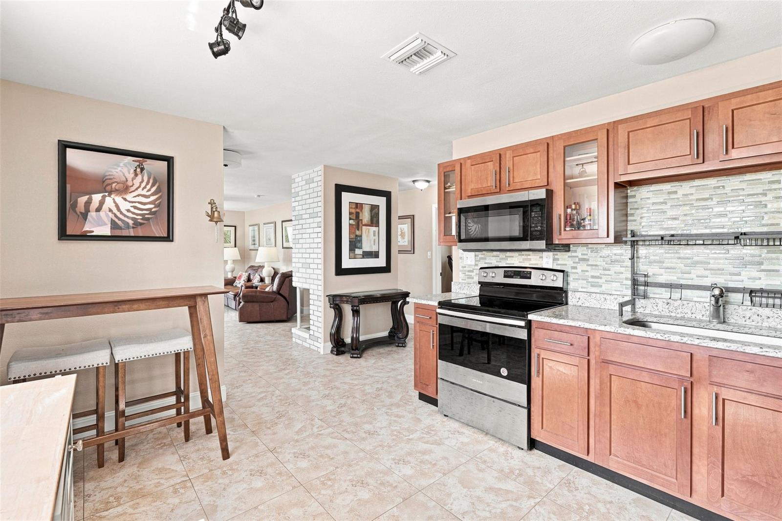 Spacious Kitchen with Tile Flooring & Breakfast Bar