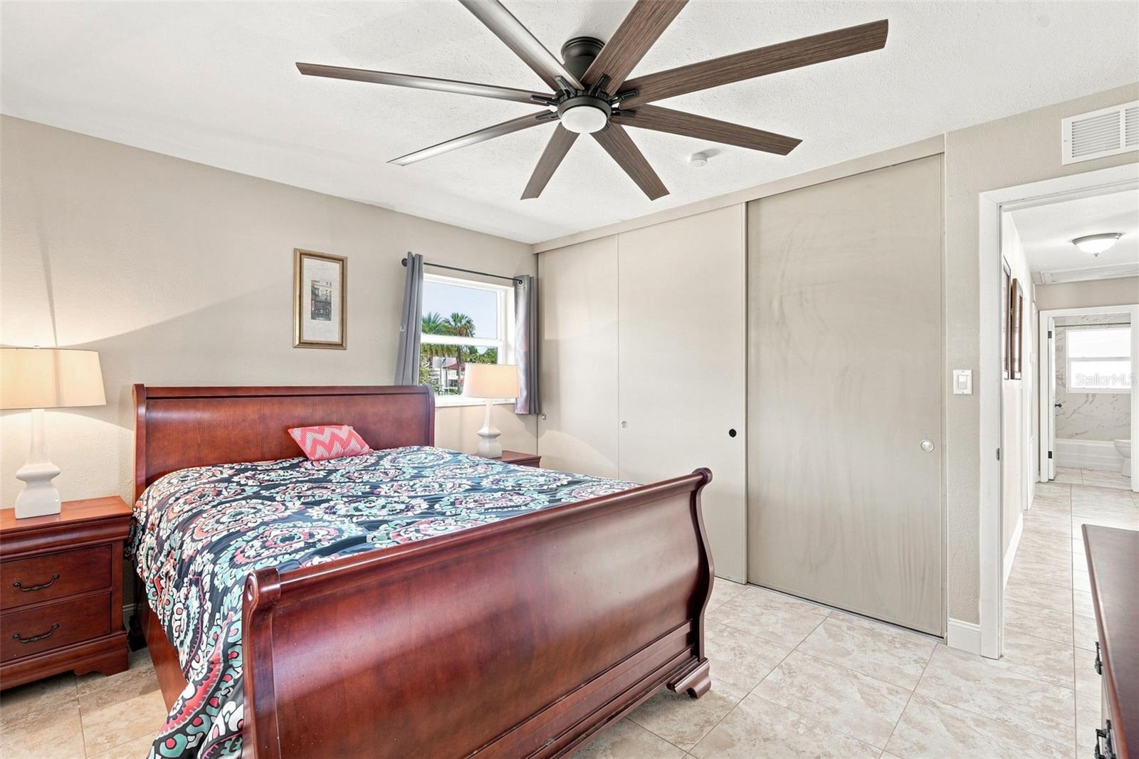 Comfortable Primary Suite with Tile Flooring & Natural Light