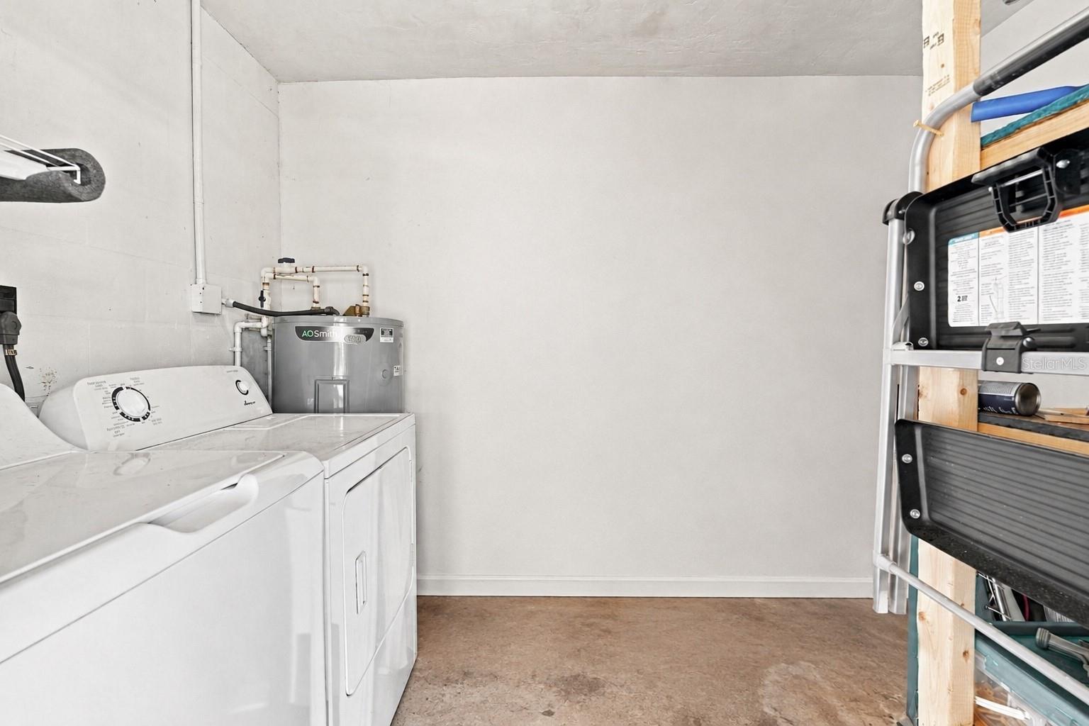 Dedicated Laundry Room with Additional Storage Room