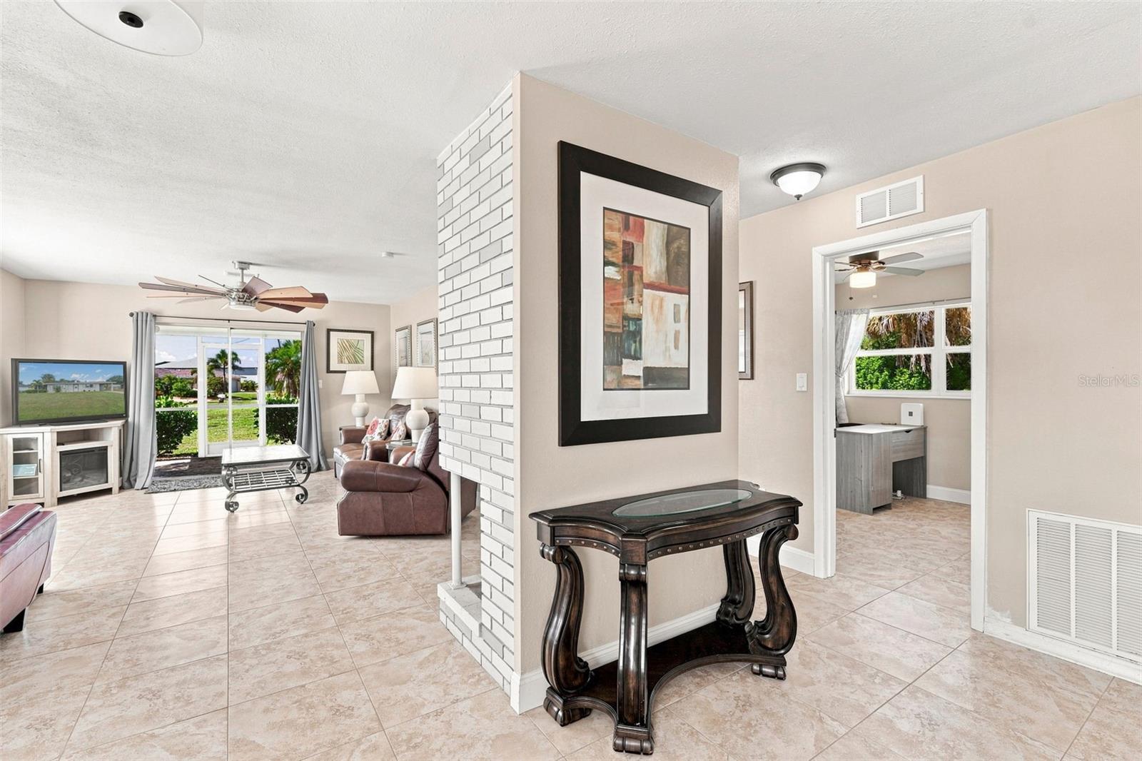 Inviting Living Area with Brick Fireplace