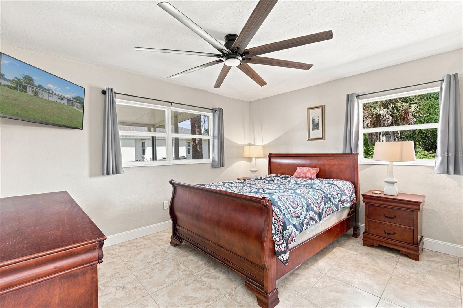 Comfortable Primary Suite with Tile Flooring & Natural Light