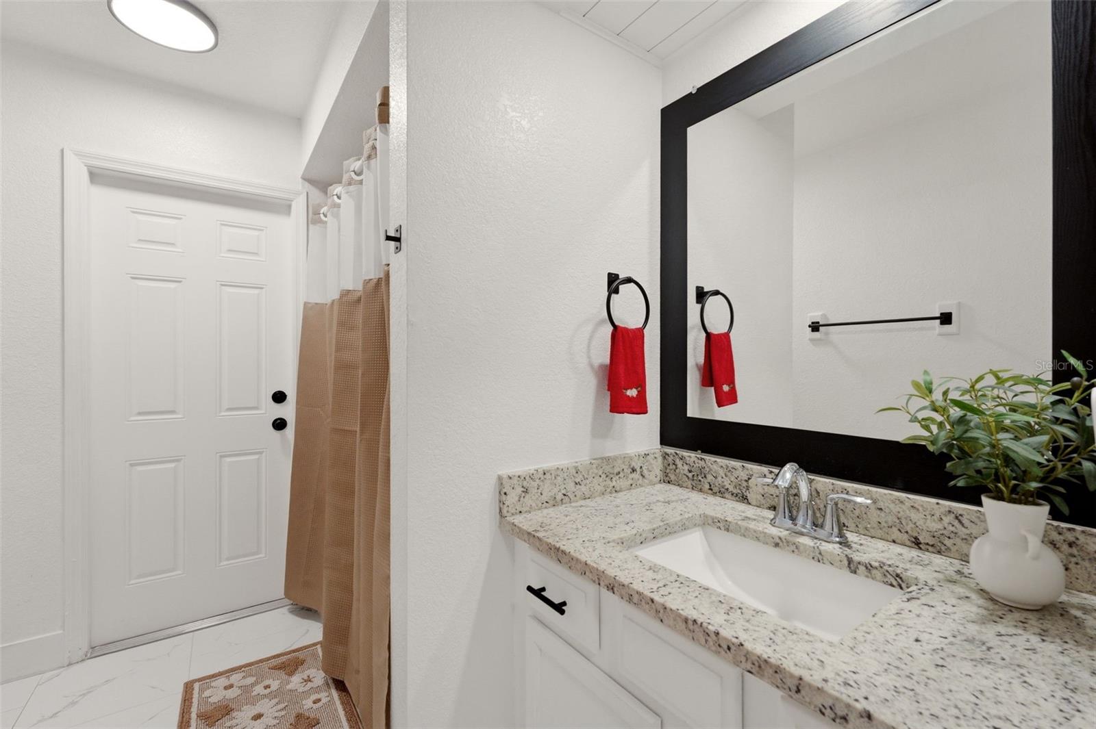 bathroom with access to the pool