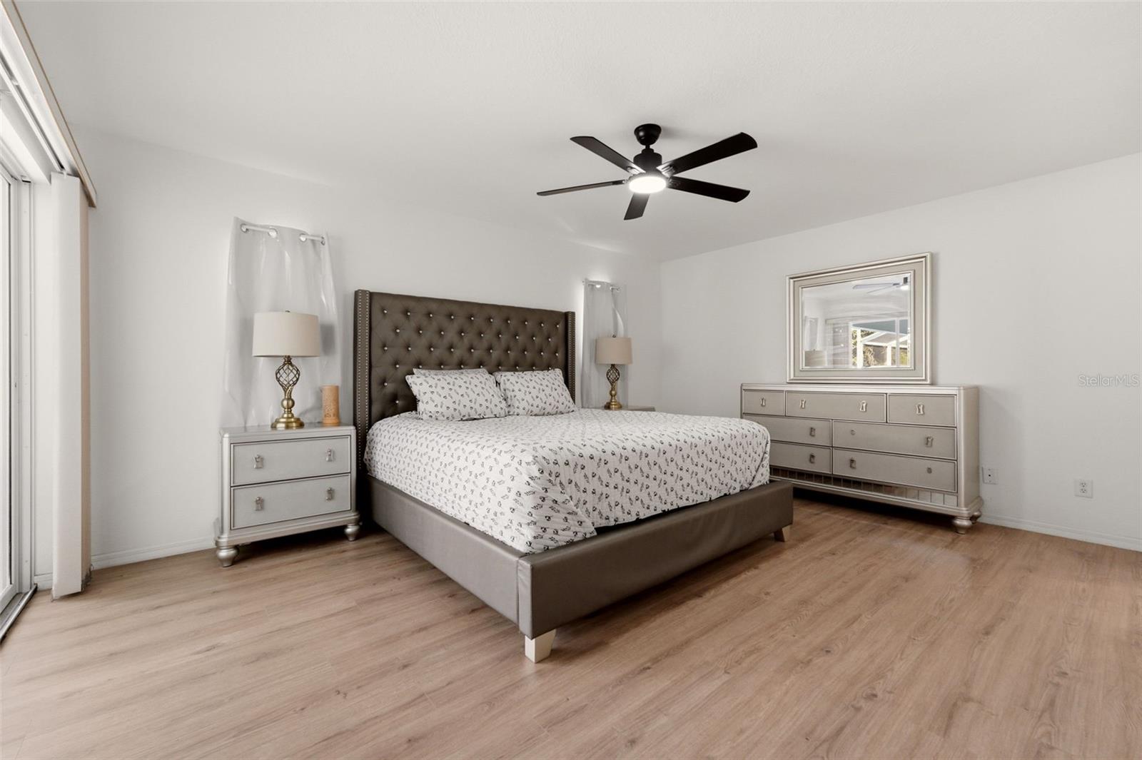 master bedroom with walk-in closet