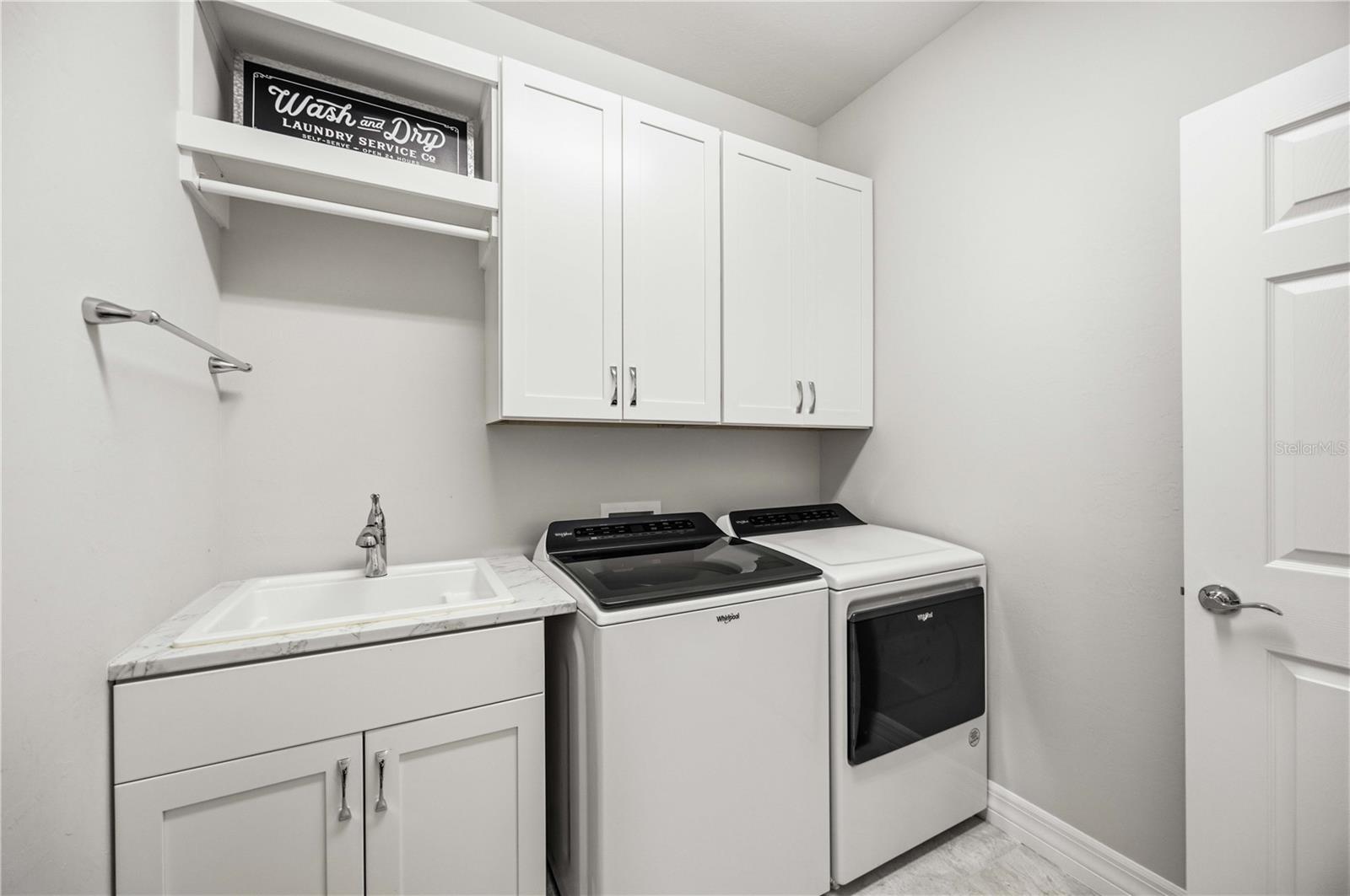 Large Laundry with sink and cabinets