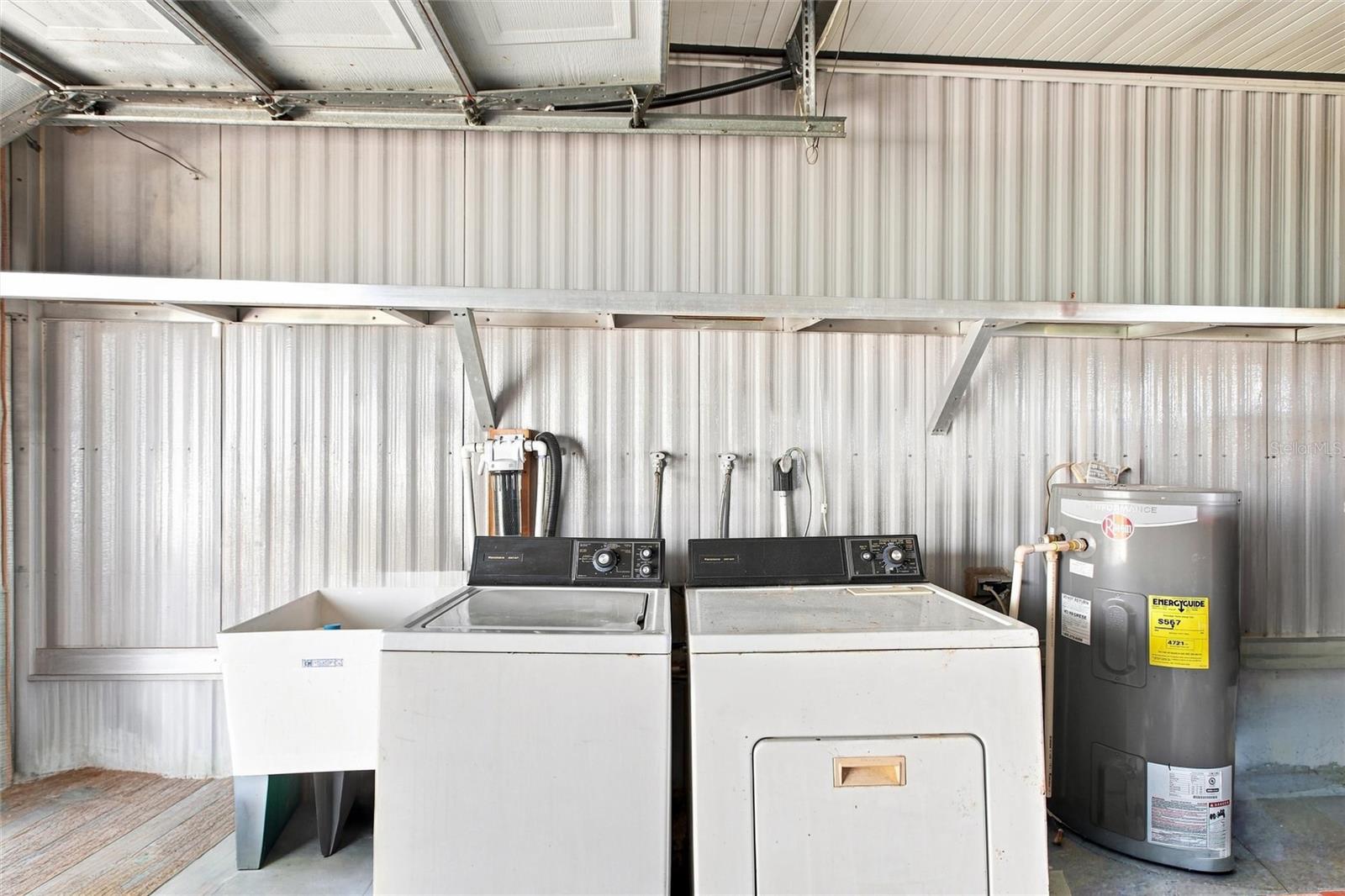 Garage with washer dryer and sink