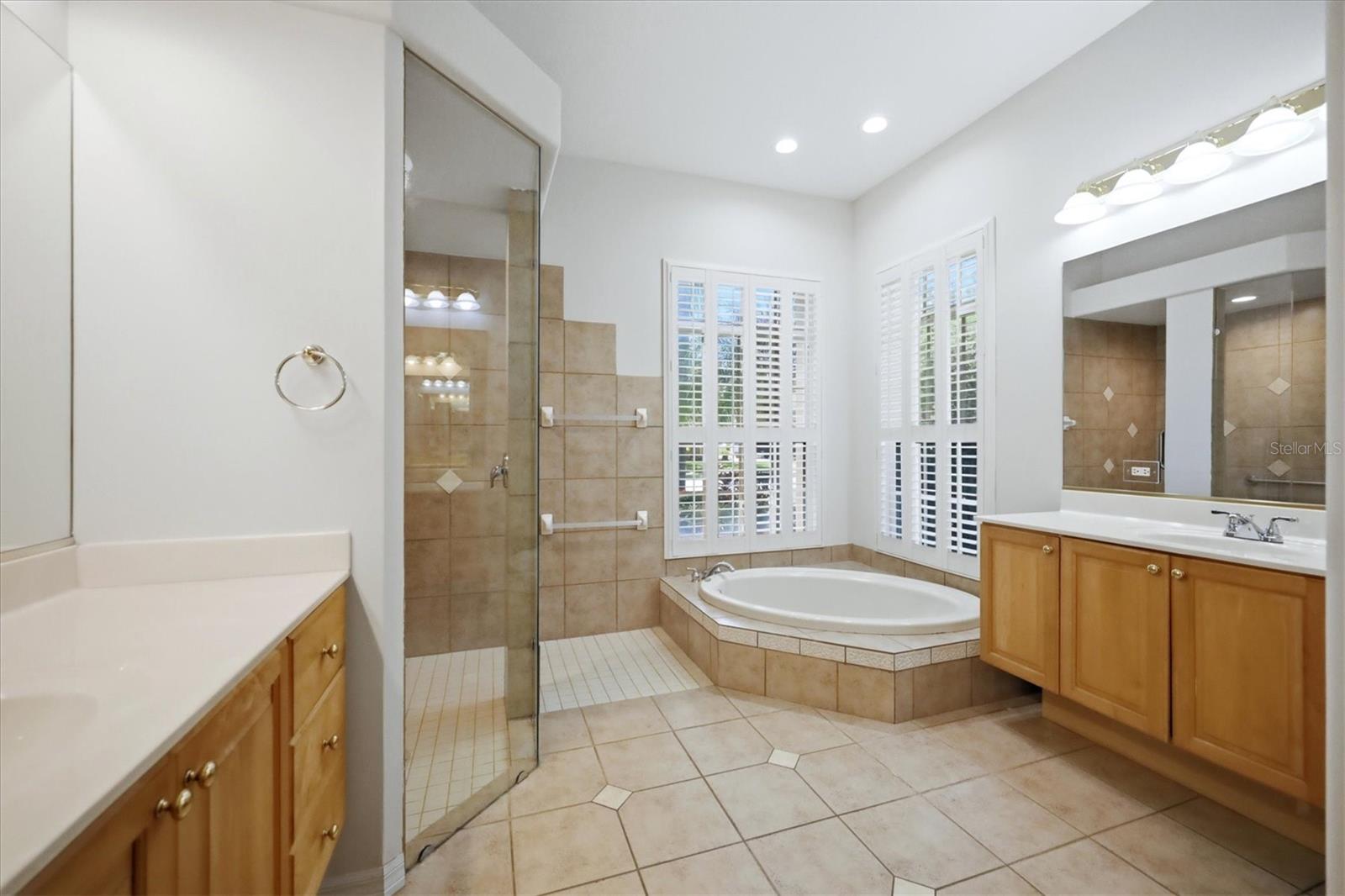 Primary bath with garden tub, walk in shower, dual vanities, separate water closet