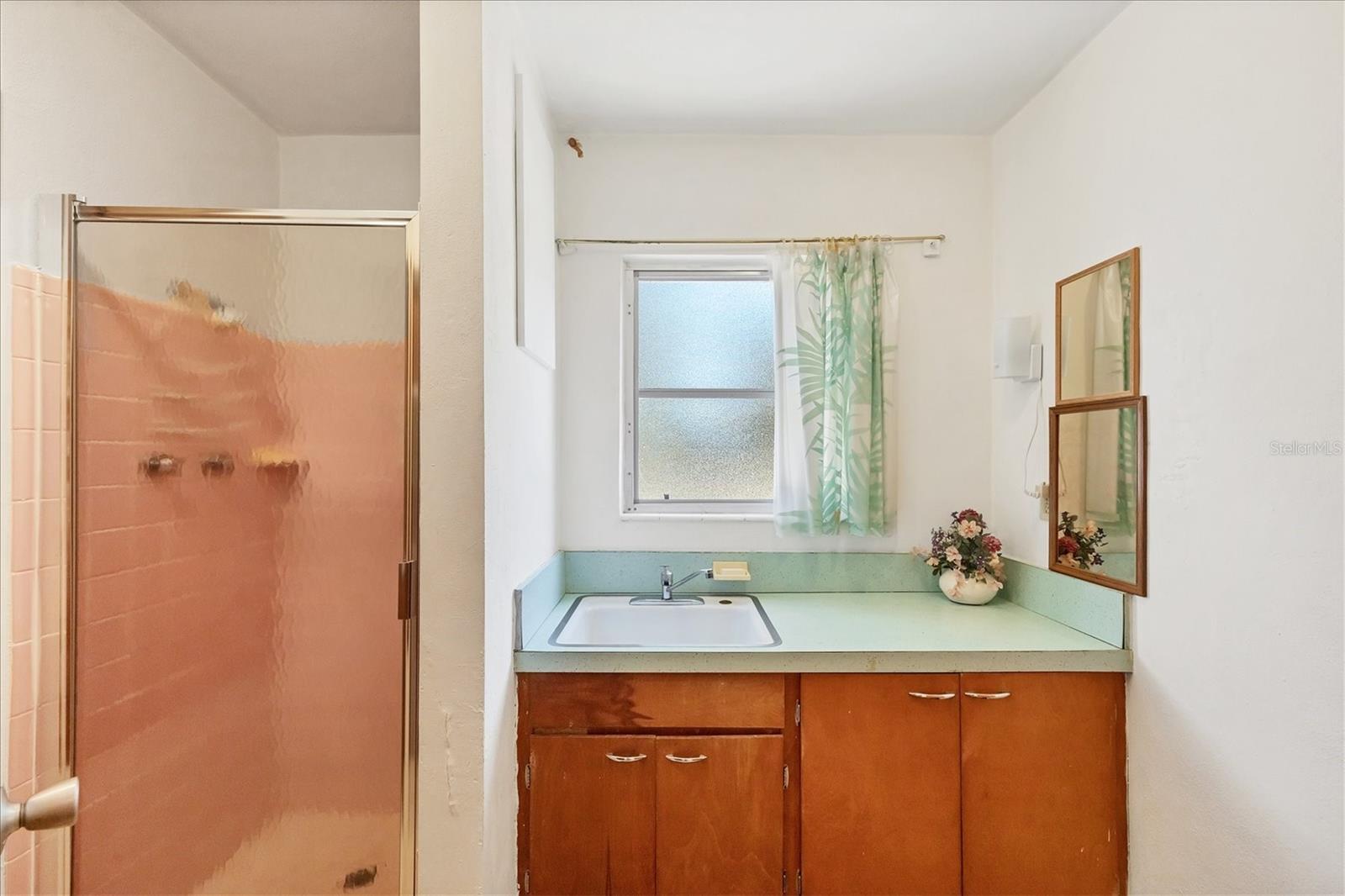 1/2 bath with a sink and shower
