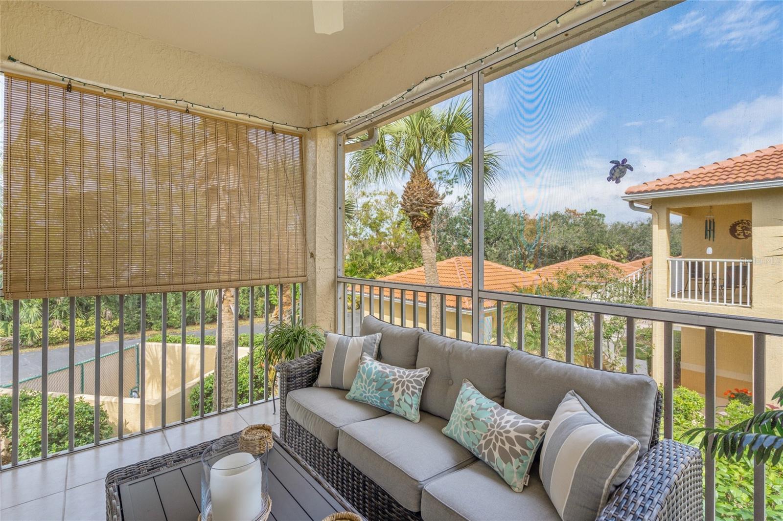 Screen In Balcony Overlooking Lake and Fountain