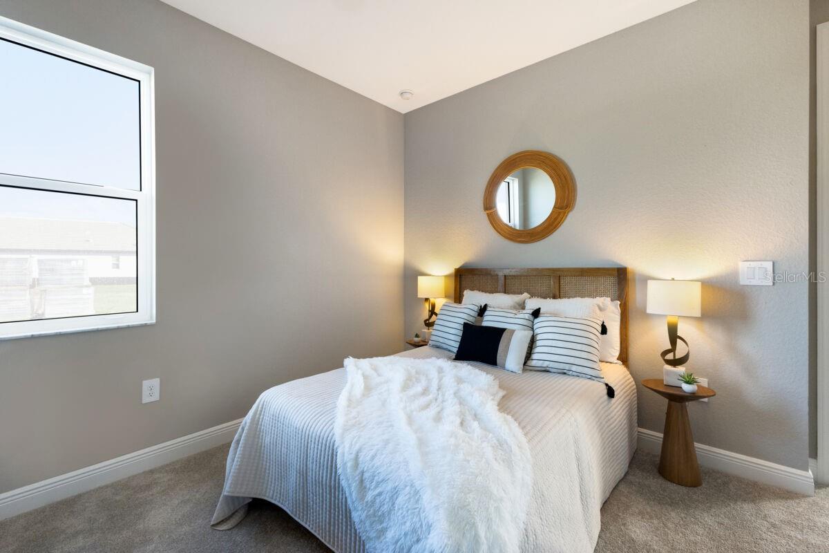 Bedroom 2-Photo description represents the model home of same floor plan.