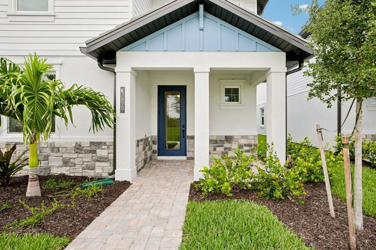 Front Exterior-Photo description represents the model home of same floor plan.